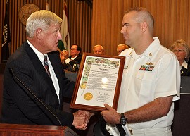 Chef Brandon Parry receives proclamation from Supervisor Cox