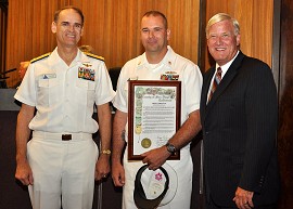 Chief Parry displays his proclamation with Cox and his boss, VADM Thomas J. Kilcline, Jr